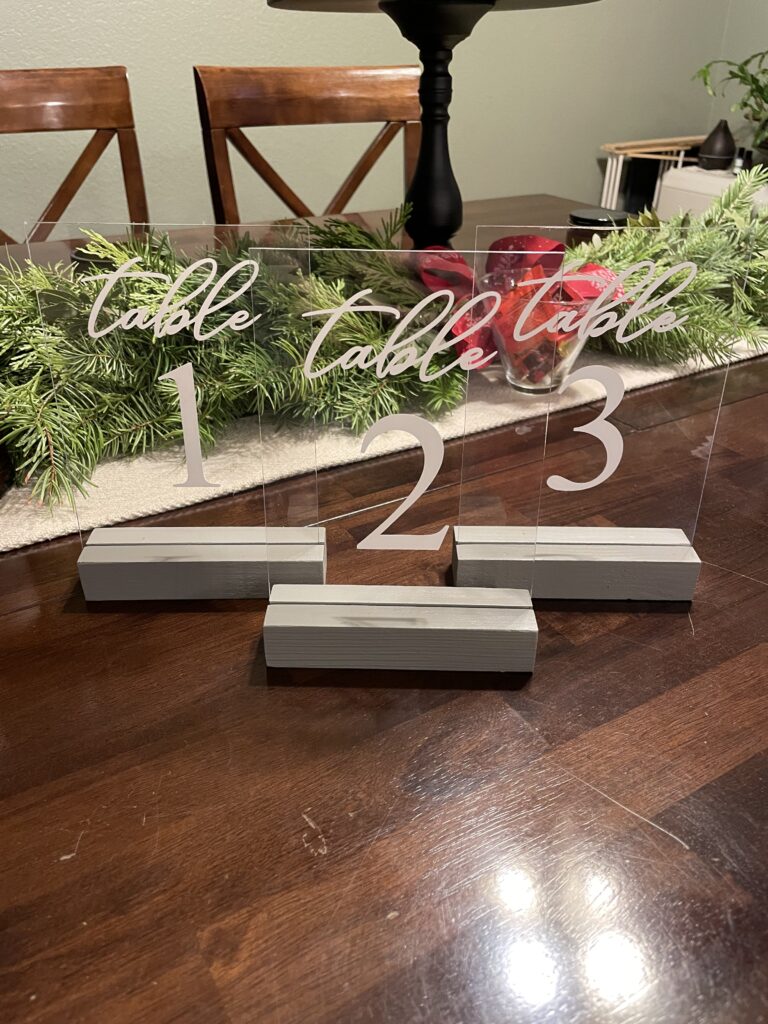 Plexi Table numbers with grey wood block stand #1-20. $3 ea.
